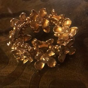 Natasha from Macy’s flower gold stretch bracelet.